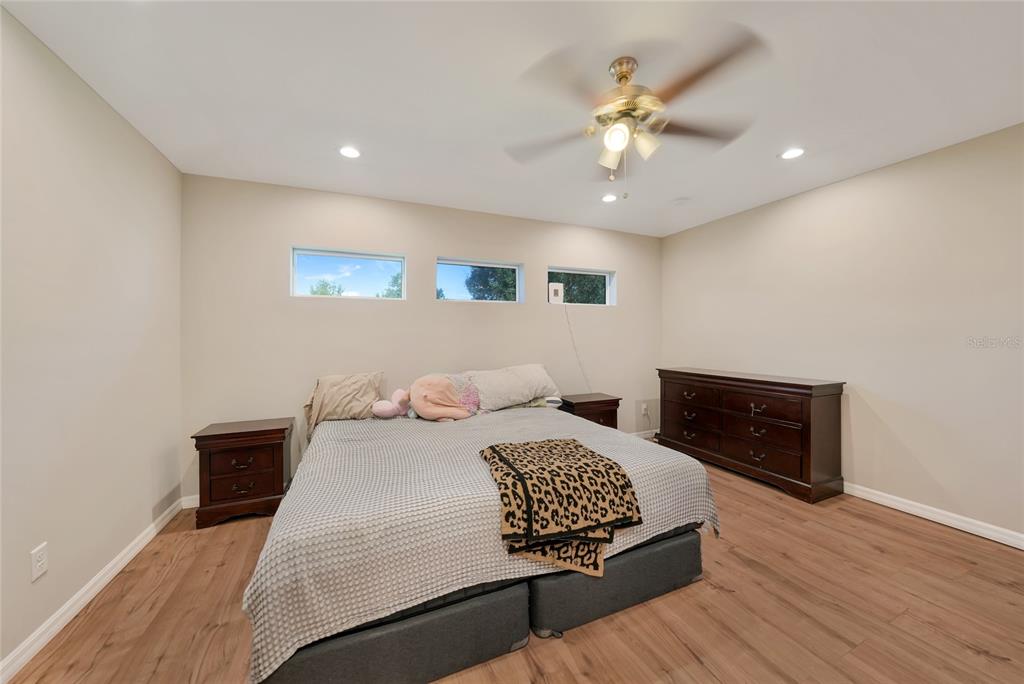 27234 Adams Street Punta Gorda, FL 33983 - Photo 20 of 29 a bedroom with a bed and a dresser
