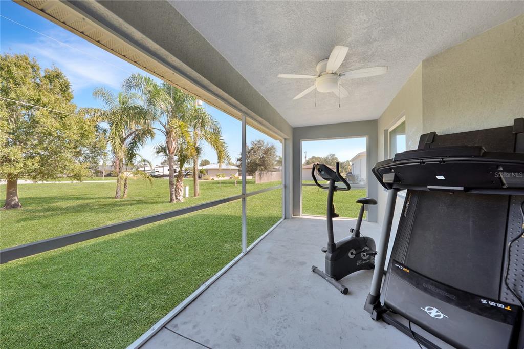 27234 Adams Street Punta Gorda, FL 33983 - Photo 26 of 29 a view of a patio with a table and chairs