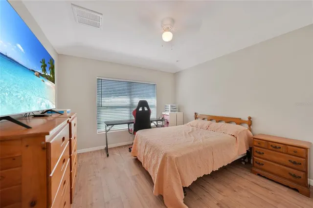 a bedroom with a bed and a dresser