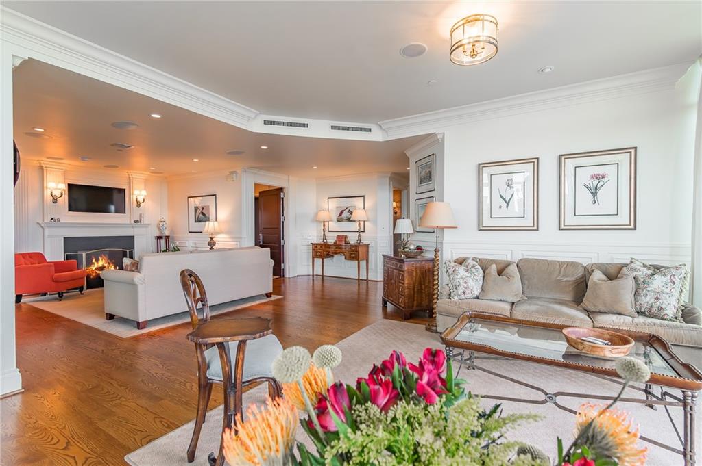 750 Park Avenue Northeast, Unit 29S Atlanta, GA 30326 - Photo 14 of 46 a living room with furniture and a flat screen tv