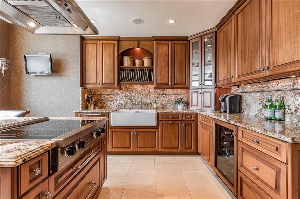 750 Park Avenue Northeast, Unit 29S Atlanta, GA 30326 - Photo 19 of 46 a kitchen with stainless steel appliances granite countertop a stove a sink and a microwave