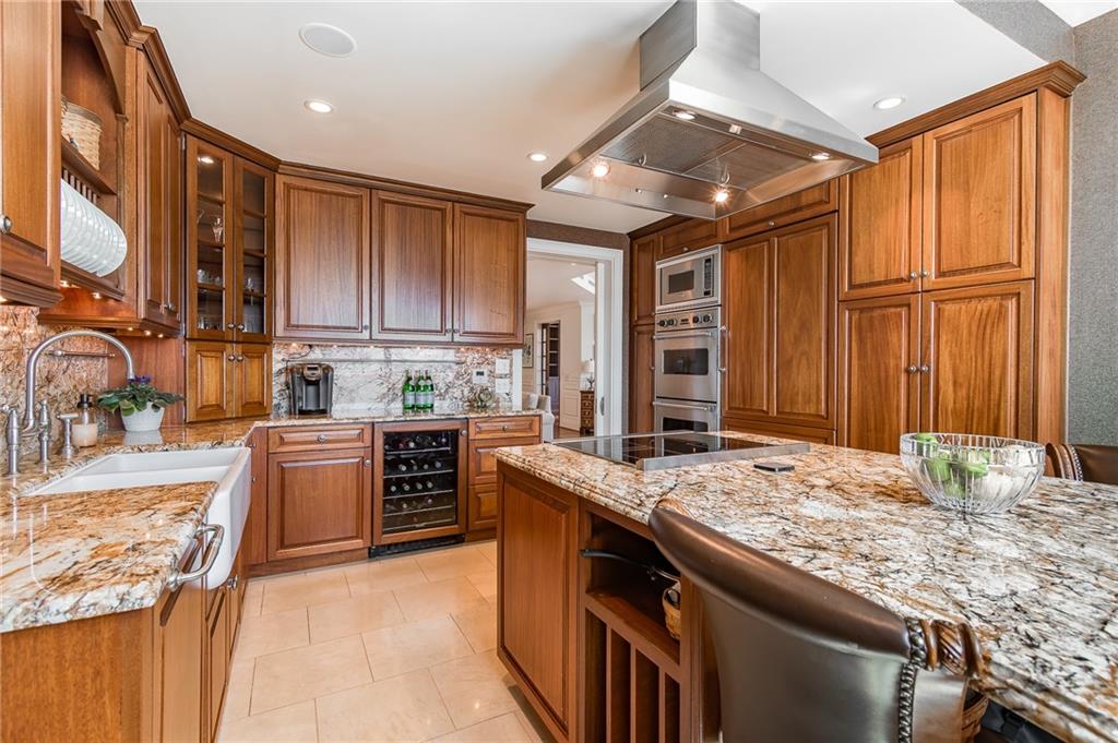 750 Park Avenue Northeast, Unit 29S Atlanta, GA 30326 - Photo 20 of 46 a kitchen with stainless steel appliances granite countertop a sink stove and refrigerator