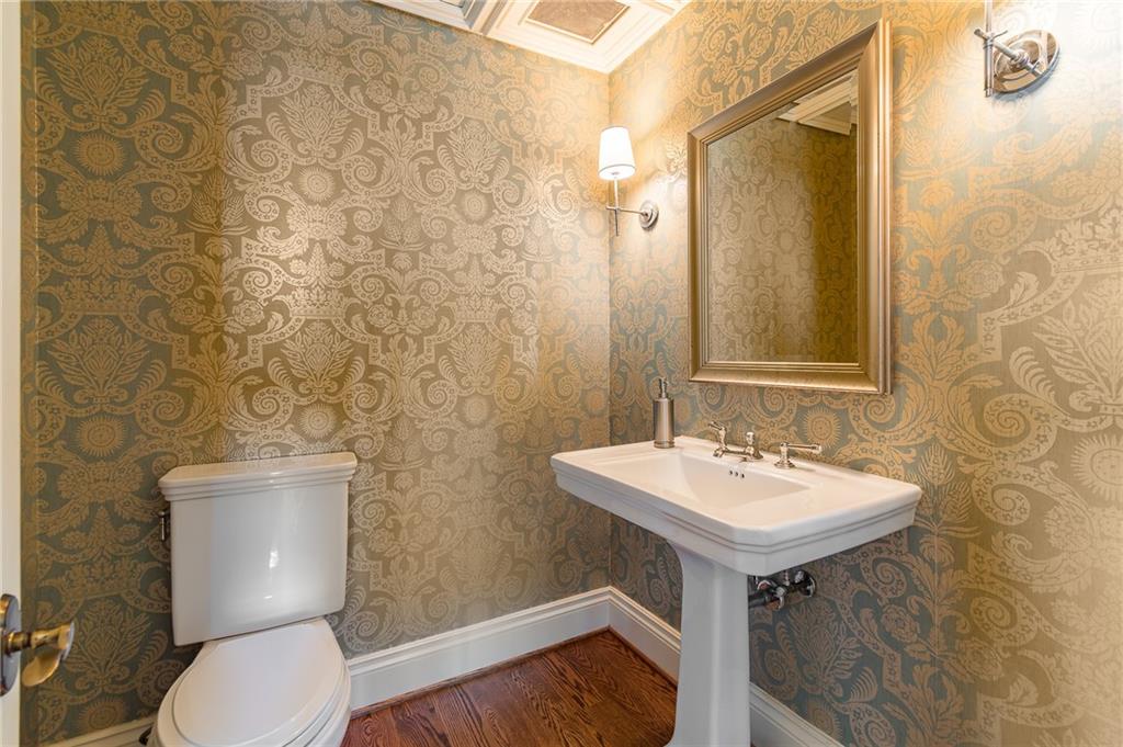 750 Park Avenue Northeast, Unit 29S Atlanta, GA 30326 - Photo 21 of 46 a bathroom with a toilet sink and mirror