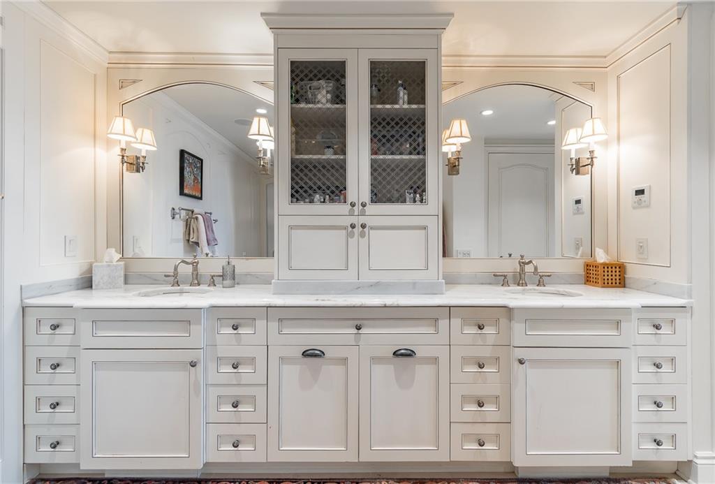 750 Park Avenue Northeast, Unit 29S Atlanta, GA 30326 - Photo 27 of 46 a bathroom with a sink vanity and mirror