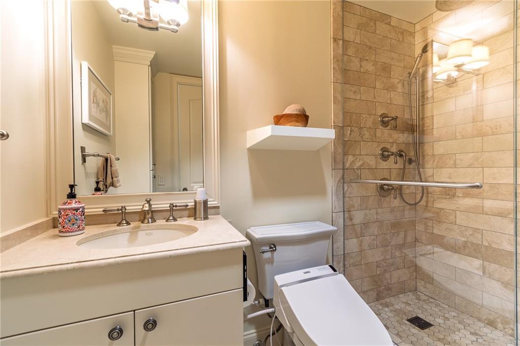 750 Park Avenue Northeast, Unit 29S Atlanta, GA 30326 - Photo 32 of 46 a bathroom with a sink toilet and shower