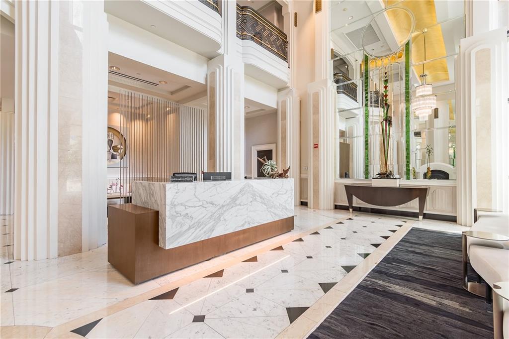 750 Park Avenue Northeast, Unit 29S Atlanta, GA 30326 - Photo 39 of 46 a living room with furniture and a rug