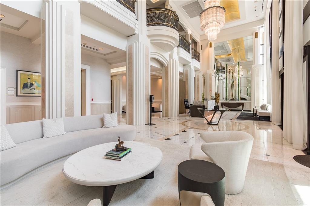 750 Park Avenue Northeast, Unit 29S Atlanta, GA 30326 - Photo 44 of 46 a living room with furniture and a table