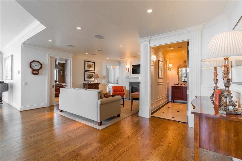 750 Park Avenue Northeast, Unit 29S Atlanta, GA 30326 - Photo 5 of 46 a living room with furniture and a wooden floor