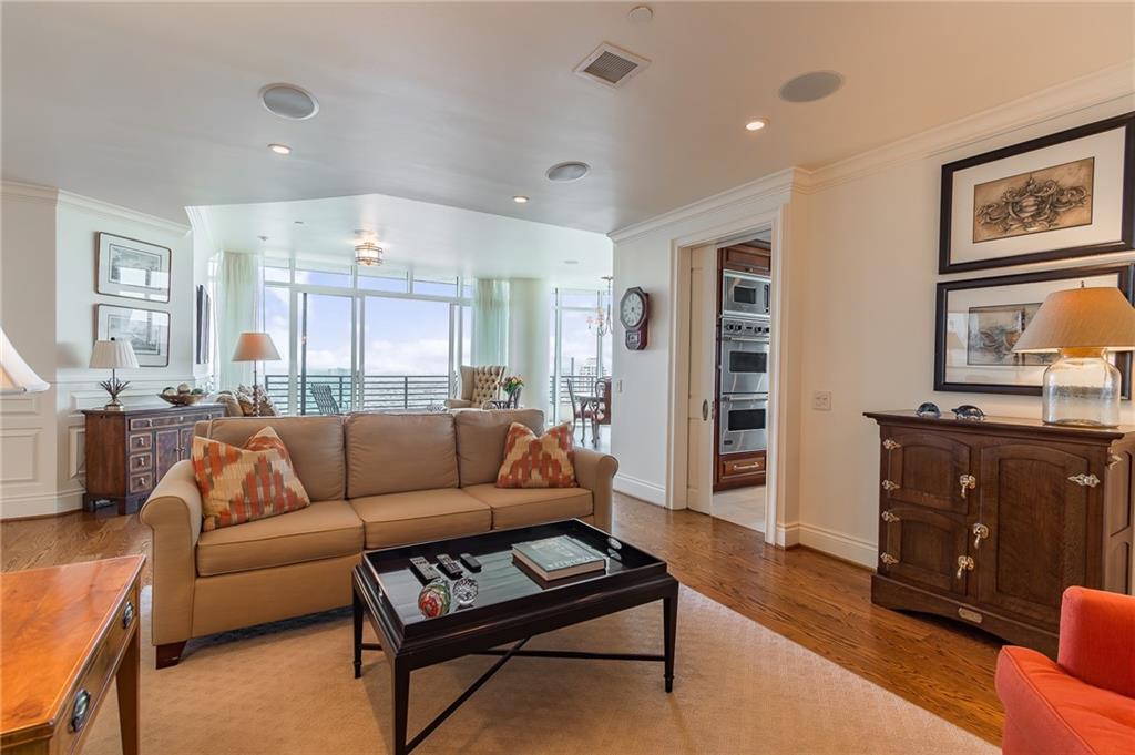 750 Park Avenue Northeast, Unit 29S Atlanta, GA 30326 - Photo 8 of 46 a living room with furniture and a flat screen tv