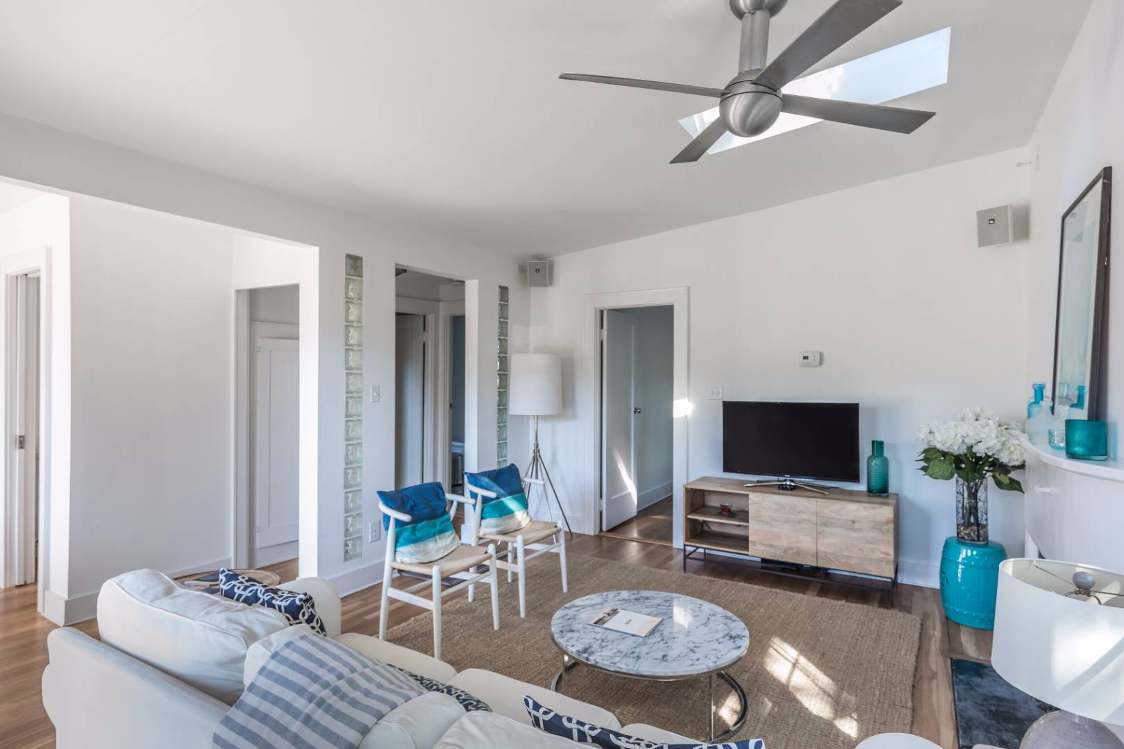 1 Sherrill Road East Hampton, NY 11937 - Photo 4 of 14 a living room with furniture and a flat screen tv