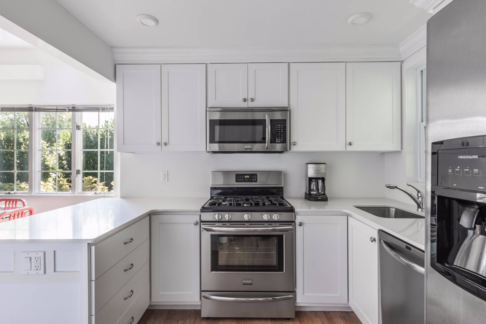 1 Sherrill Road East Hampton, NY 11937 - Photo 9 of 14 a kitchen with white cabinets and appliances