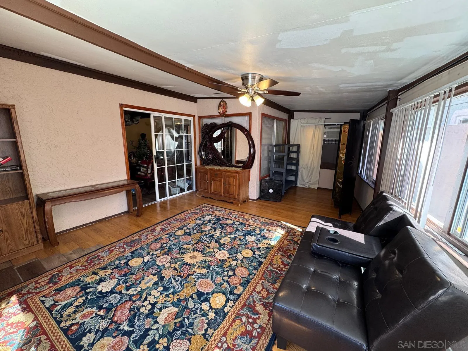 a bedroom with furniture and a window