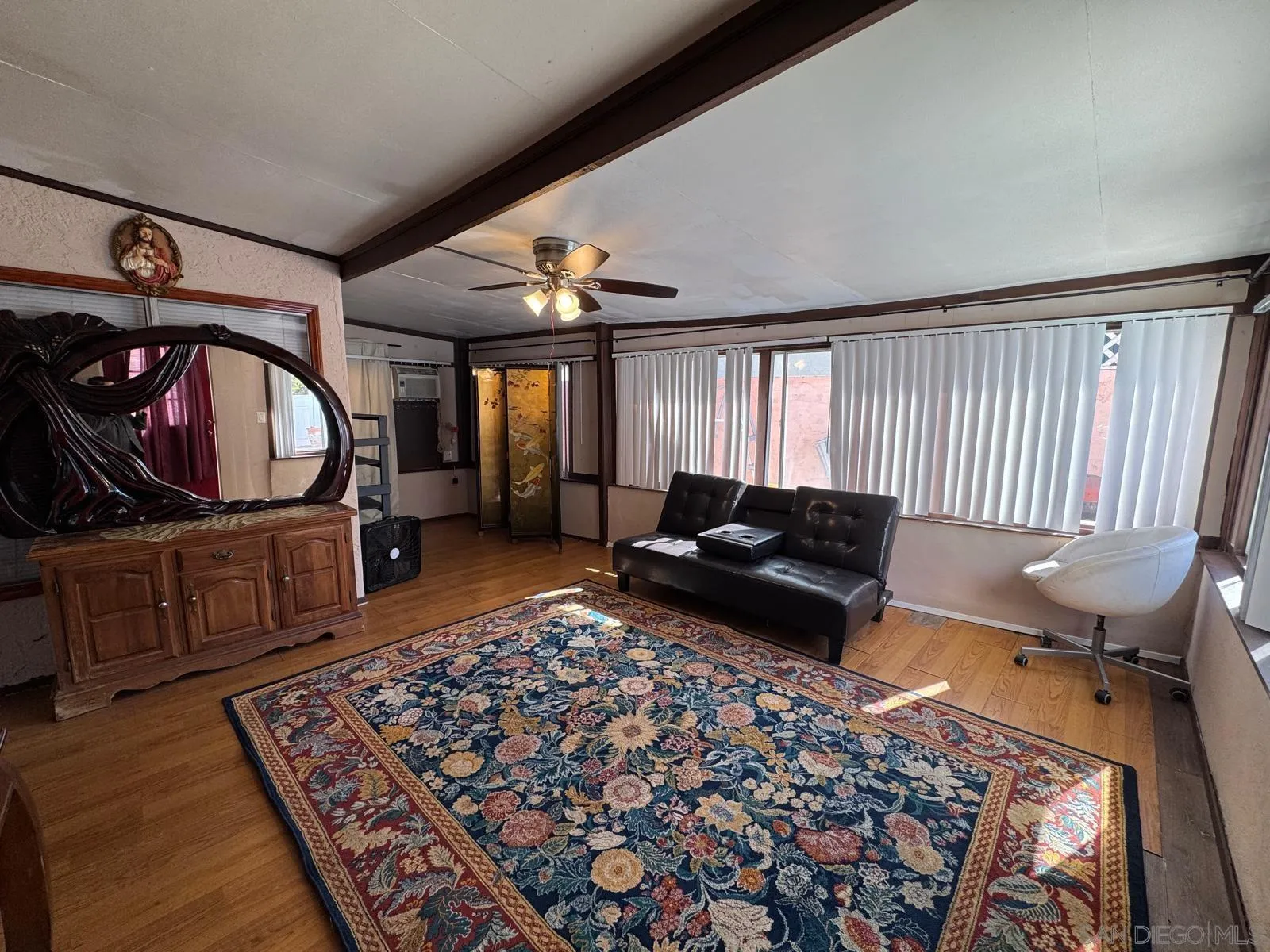 7933 Merrington Place, Unit ROOM FOR RENT San Diego, CA 92126 - Photo 2 of 4 a living room with furniture rug and a window