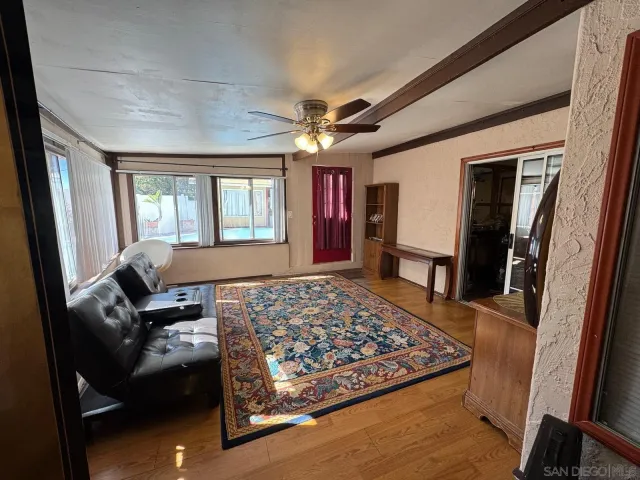 a living room with furniture and a rug