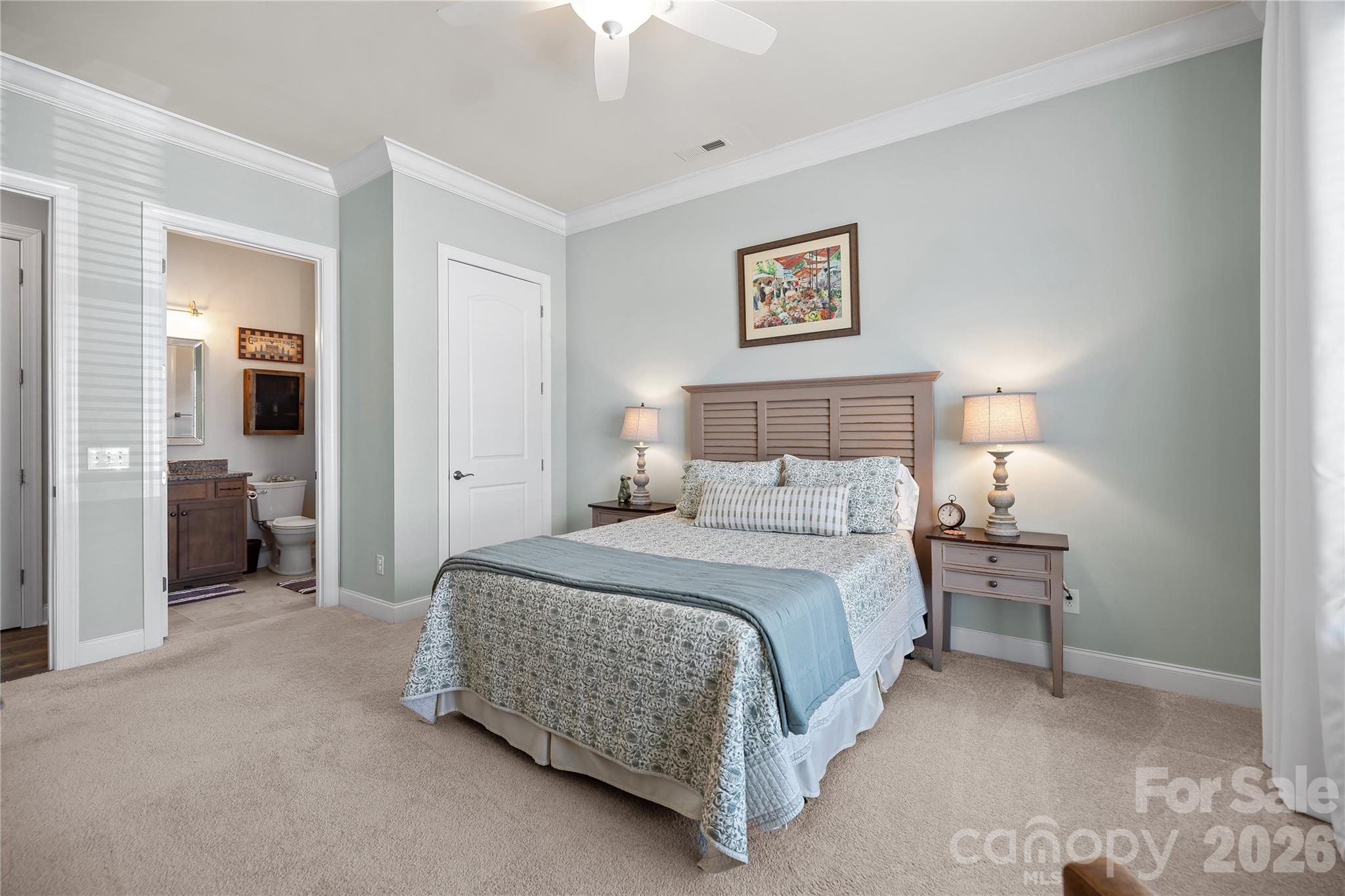 1106 Castle Road Fort Mill, SC 29707 - Photo 26 of 44 a spacious bedroom with a bed and a lamp