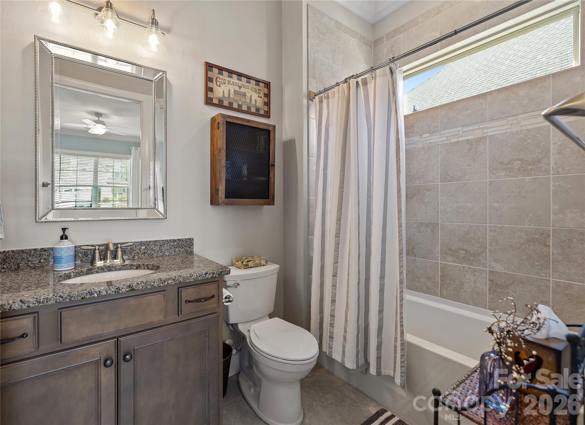 1106 Castle Road Fort Mill, SC 29707 - Photo 27 of 44 a bathroom with a granite countertop toilet sink and mirror