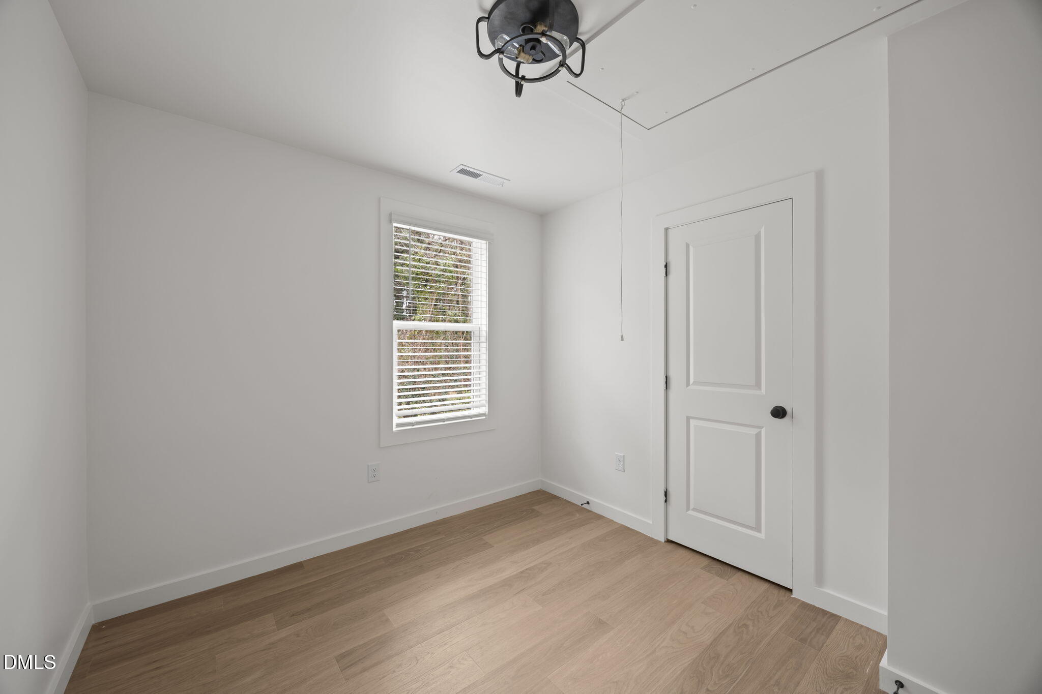2811 Wilcox Street, Unit 103 Raleigh, NC 27607 - Photo 13 of 17 a view of an empty room with a window