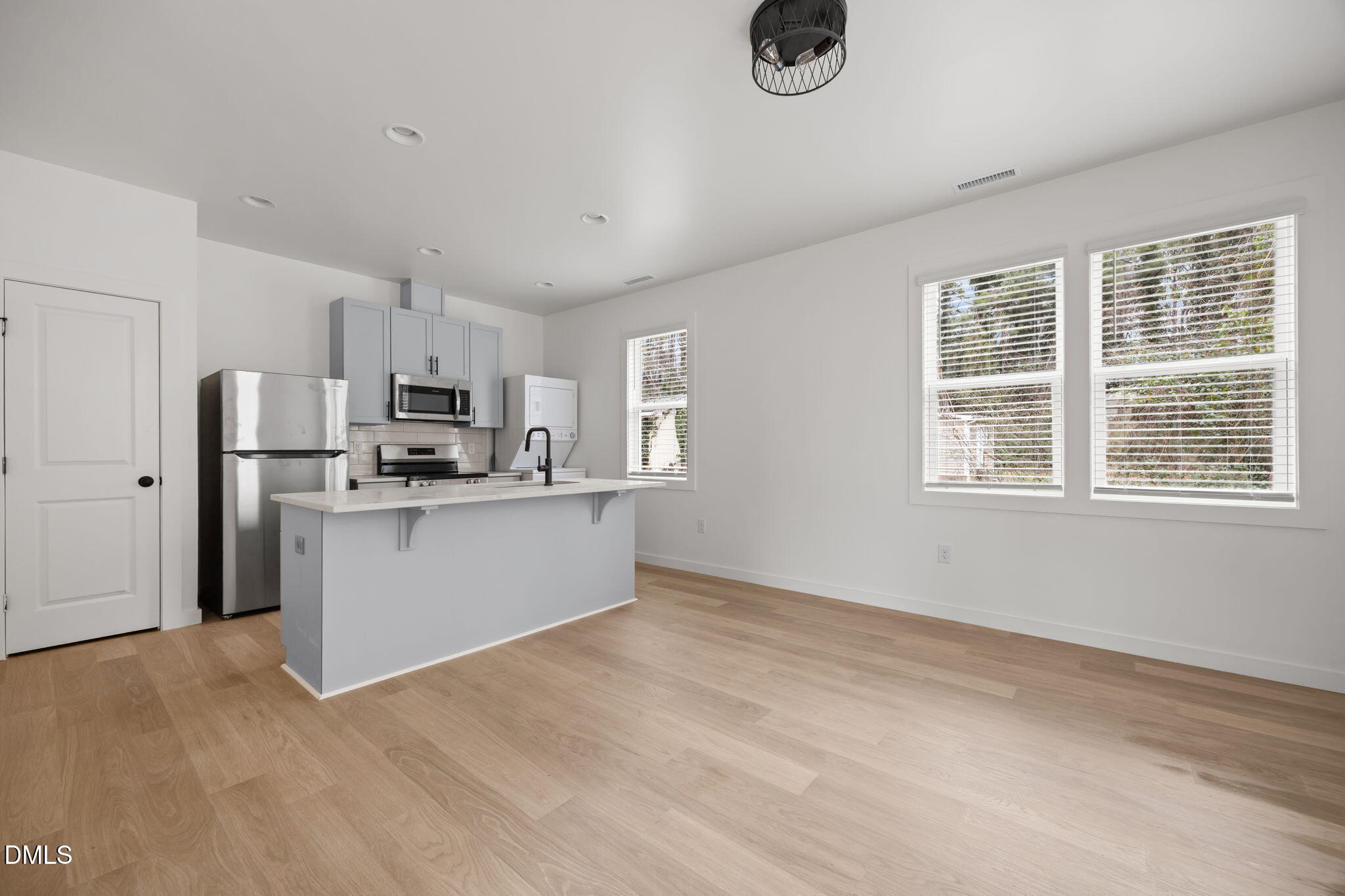 2811 Wilcox Street, Unit 103 Raleigh, NC 27607 - Photo 14 of 17 a view of kitchen with stainless steel appliances cabinets and a refrigerator
