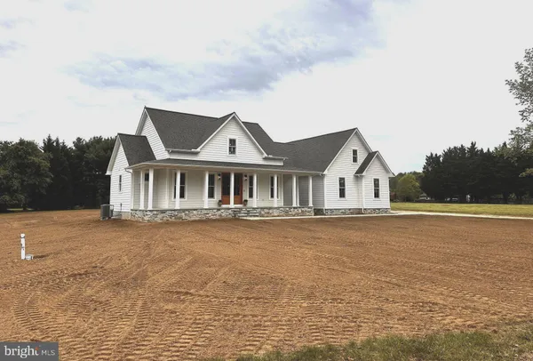 a front view of a house with yard