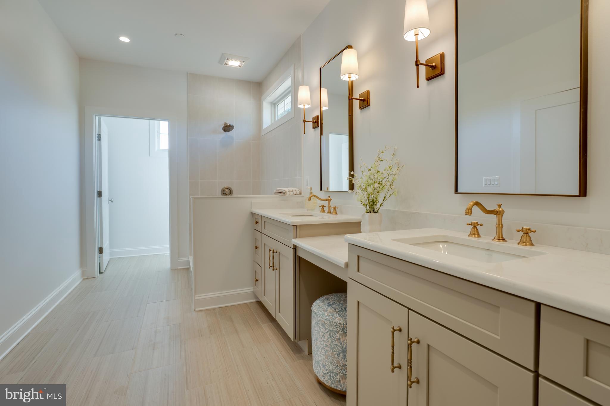 205 River Road Chestertown, MD 21620 - Photo 28 of 72 a spacious bathroom with a granite countertop sink a mirror and a