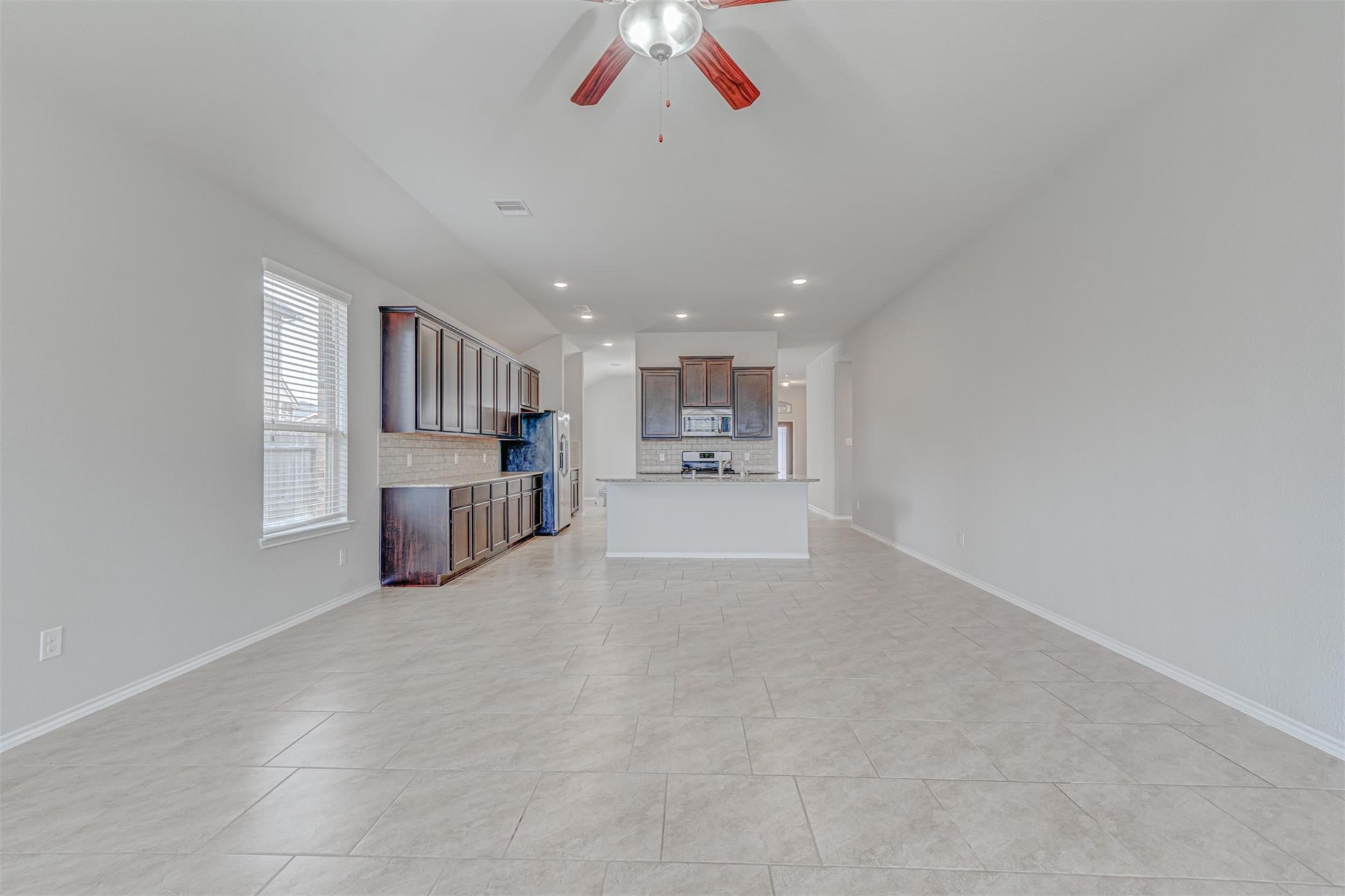 24311 North Newcastle Bay Trail Spring, TX 77389 - Photo 13 of 25 a view of a kitchen with a sink and cabinets