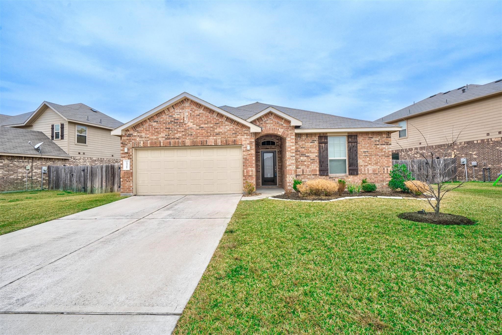 24311 North Newcastle Bay Trail Spring, TX 77389 - Photo 2 of 25 a front view of house with yard and green space