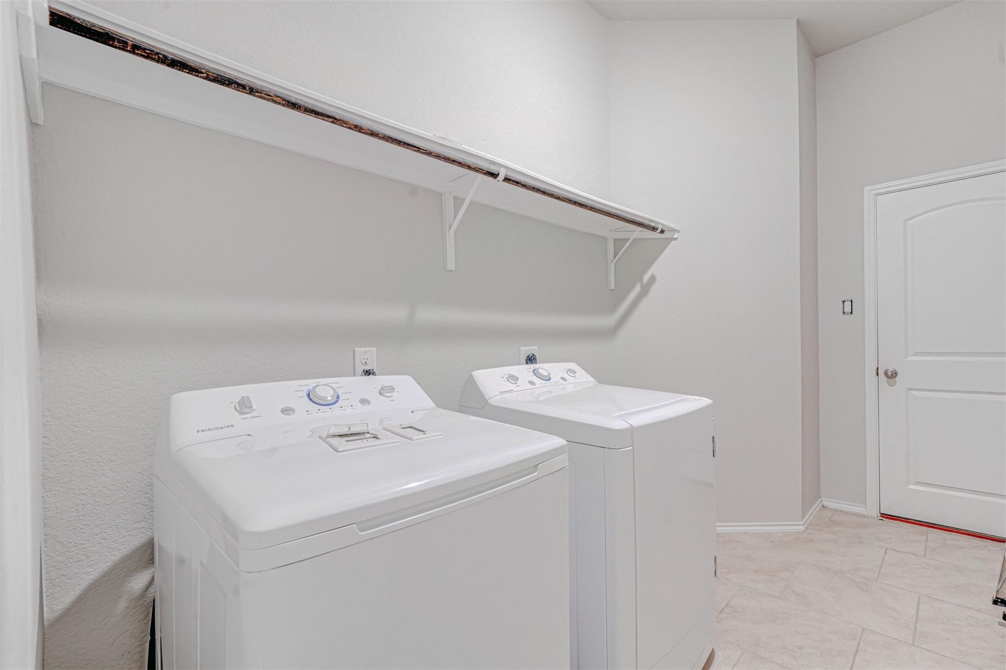 24311 North Newcastle Bay Trail Spring, TX 77389 - Photo 22 of 25 a utility room with dryer and washer