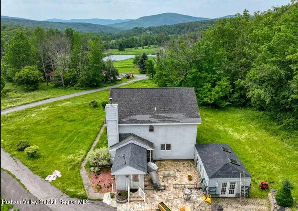 a aerial view of a house with a yard