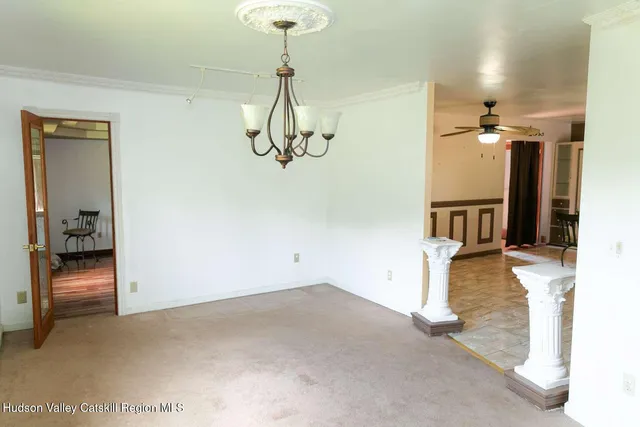 a view of a room with a chandelier