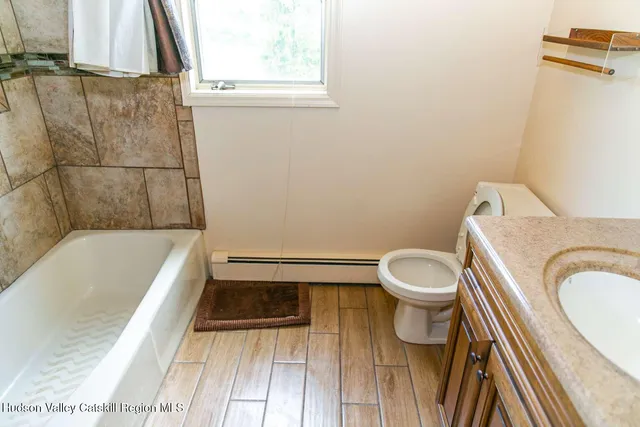 a bathroom with a sink a toilet and a bathtub