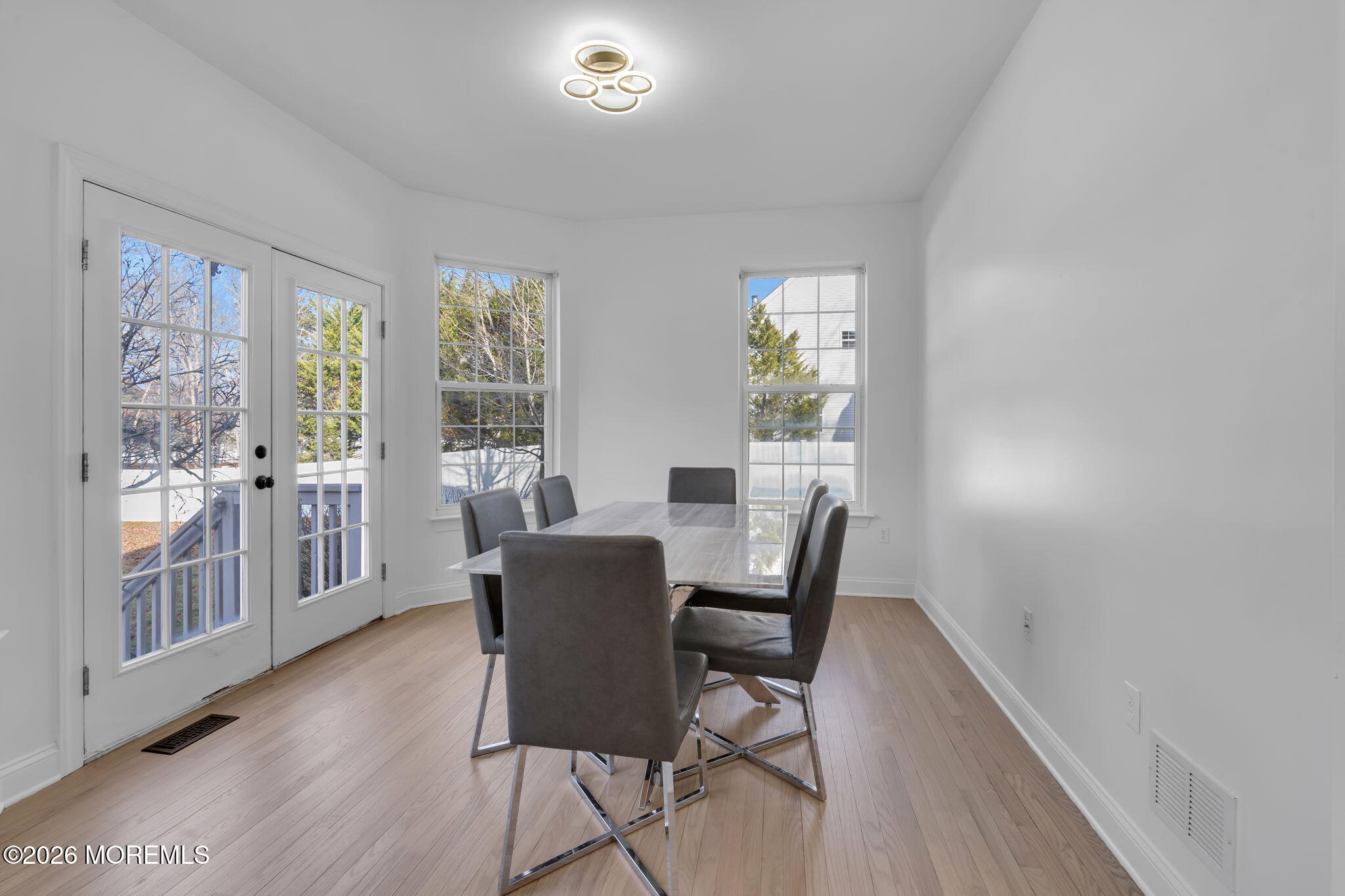 10 Meadow Run Court Jackson, NJ 08527 - Photo 14 of 84 a view of a dining room with furniture a potted plant and wooden floor