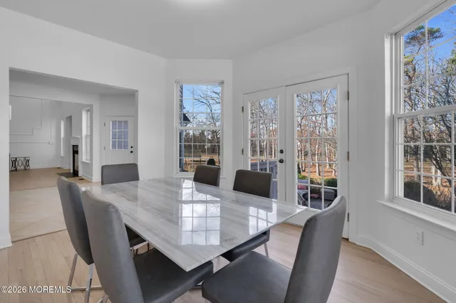 a large bedroom with a large bed and a fireplace