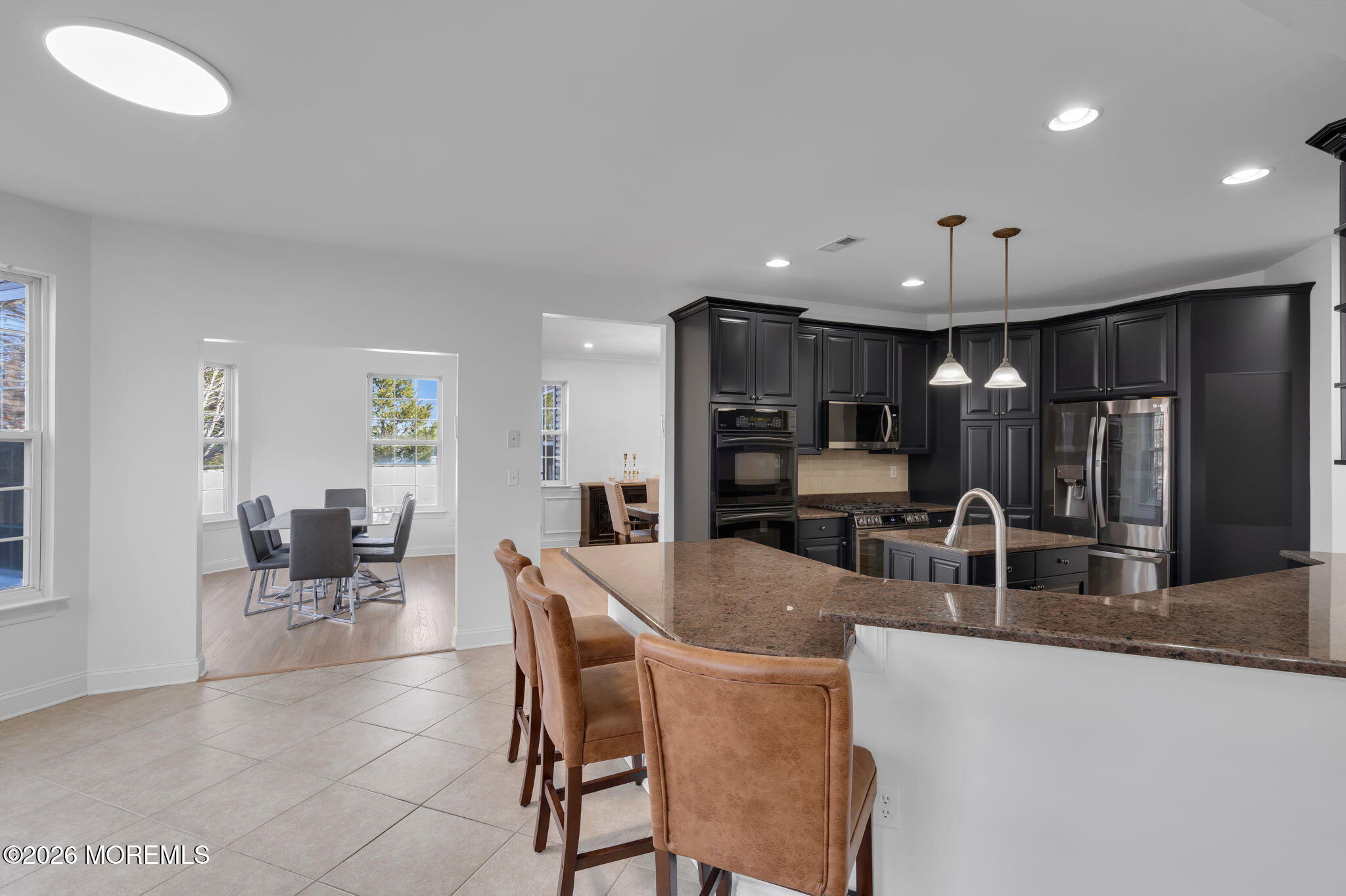10 Meadow Run Court Jackson, NJ 08527 - Photo 19 of 84 a kitchen with stainless steel appliances kitchen island granite countertop a sink and cabinets