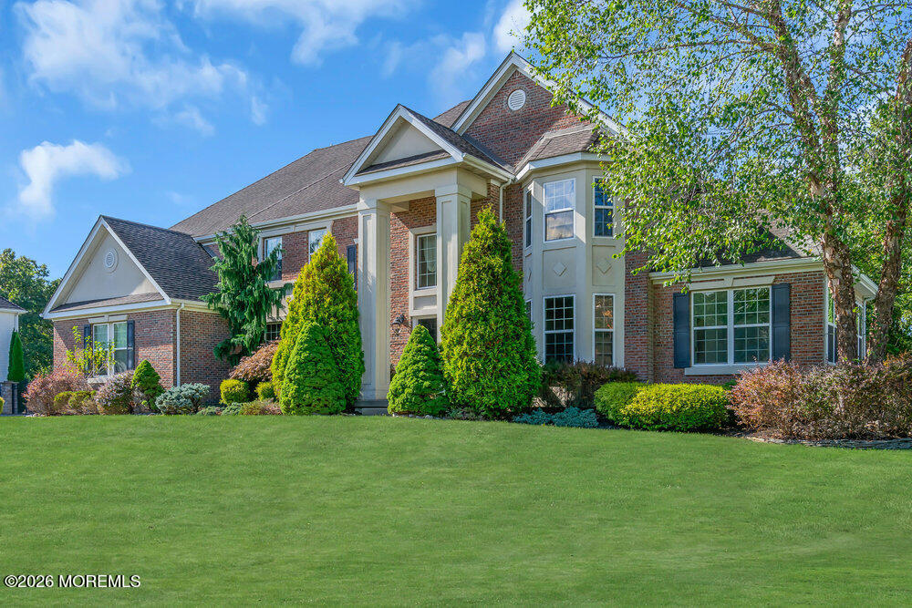 10 Meadow Run Court Jackson, NJ 08527 - Photo 2 of 84 a front view of a house with a garden and plants