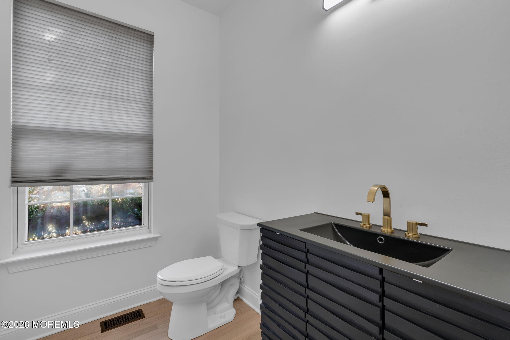 10 Meadow Run Court Jackson, NJ 08527 - Photo 25 of 84 a bathroom with a sink a toilet and mirror