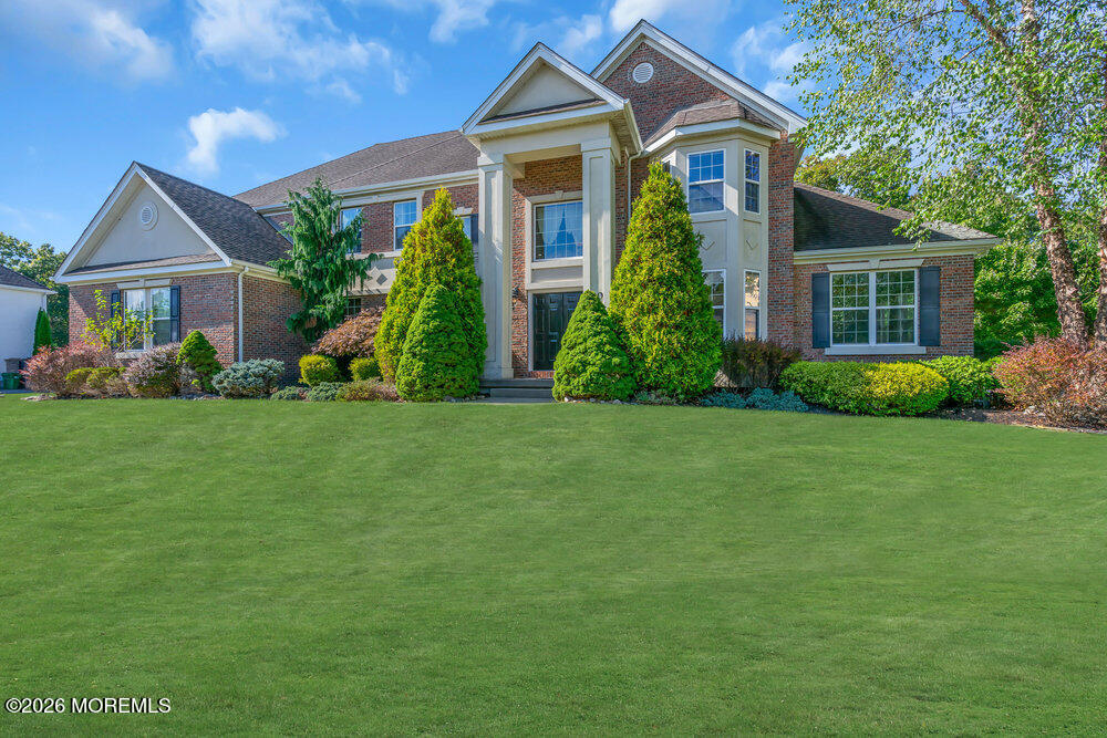 10 Meadow Run Court Jackson, NJ 08527 - Photo 3 of 84 a front view of a house with a yard and potted plants