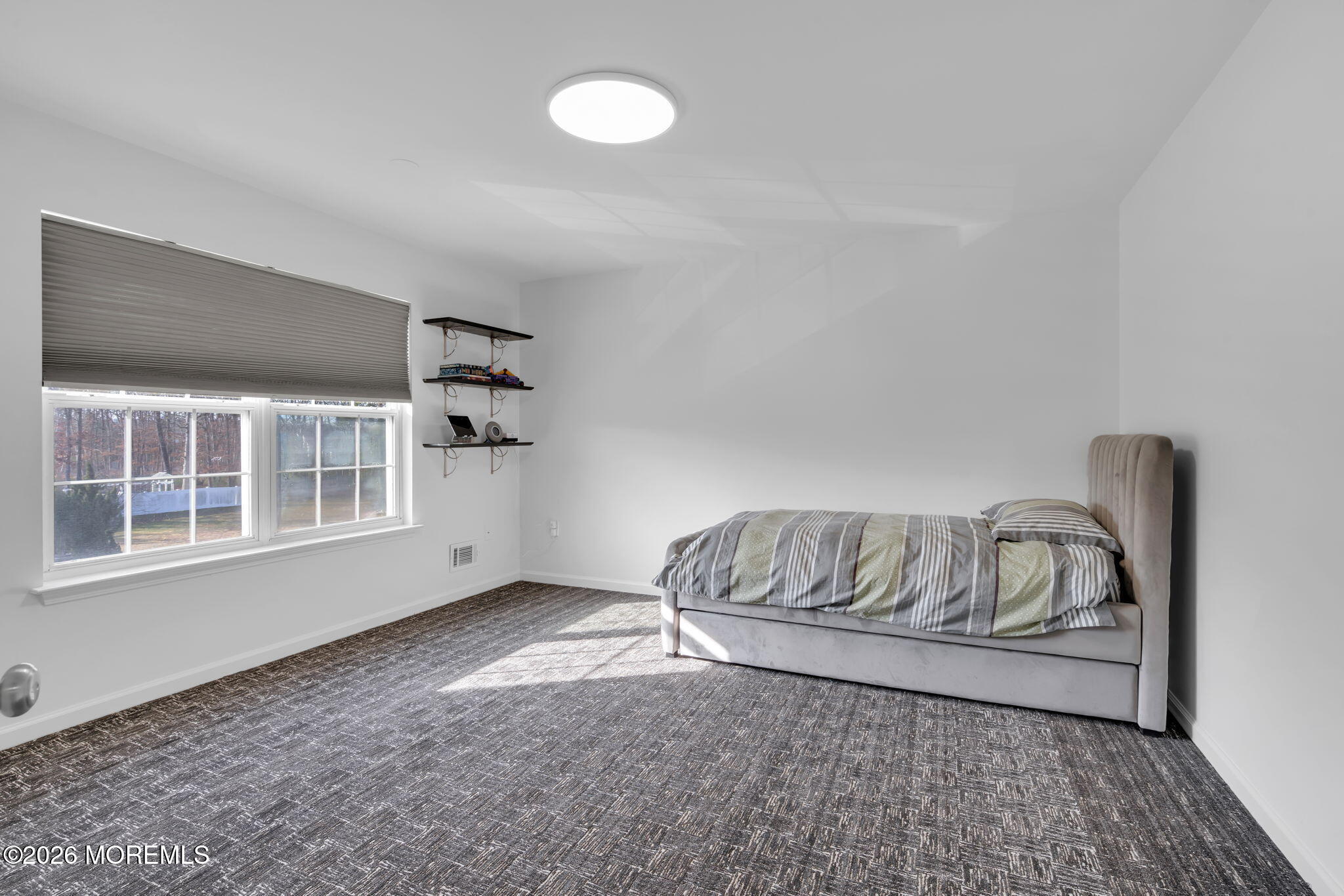10 Meadow Run Court Jackson, NJ 08527 - Photo 41 of 84 a living room with a couch and a window