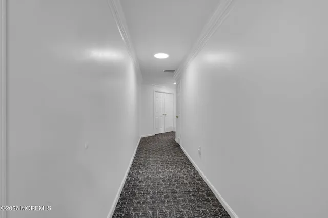 a view of a big house with a big yard and large trees