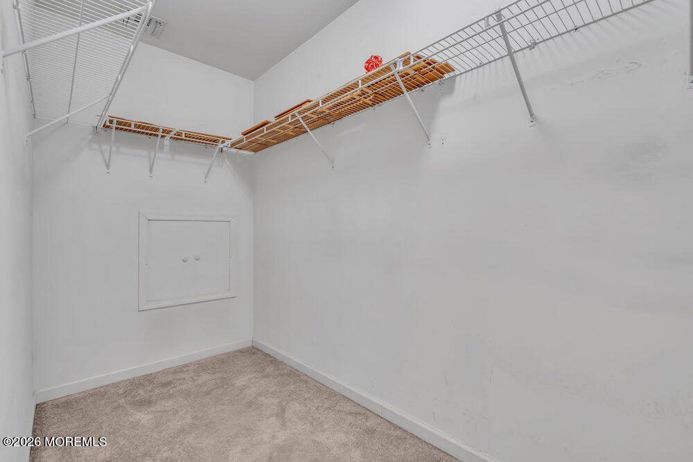 10 Meadow Run Court Jackson, NJ 08527 - Photo 56 of 84 a view of a room with racks on the wall