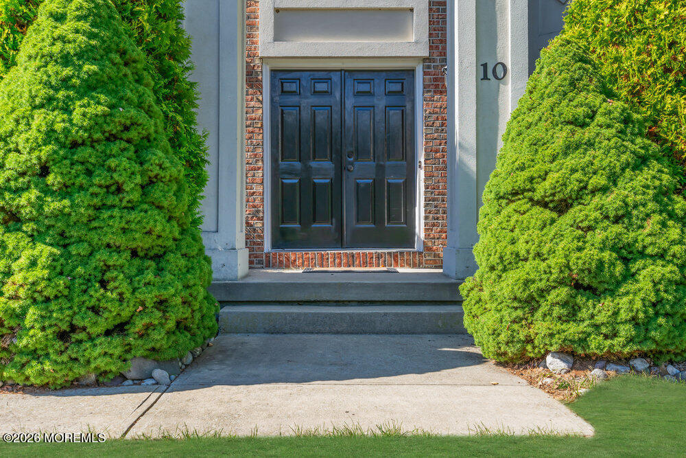10 Meadow Run Court Jackson, NJ 08527 - Photo 6 of 84 a view of entrance of house and yard with green space