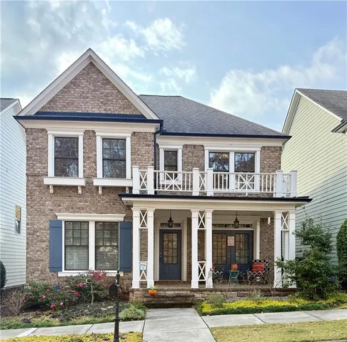 a view of a yard in front of a brick house