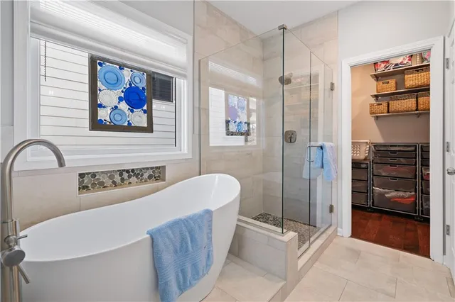 a bathroom with a sink a vanity and a shower