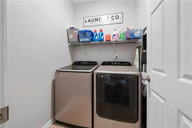 a utility room with washer and dryer