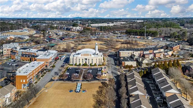 a view of a swimming pool with outdoor seating