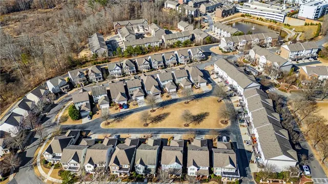 an aerial view of residential building and parking space