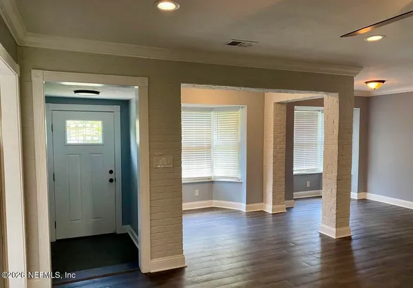 a view of walk in closet with empty room