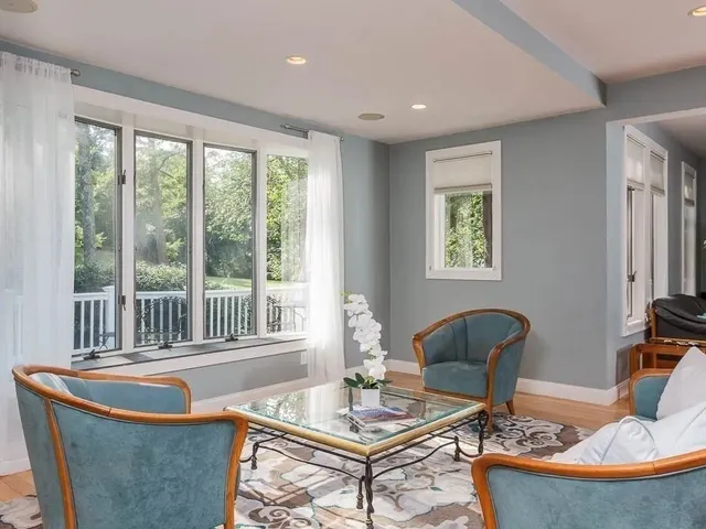 a view of a dining room with furniture window and outside view