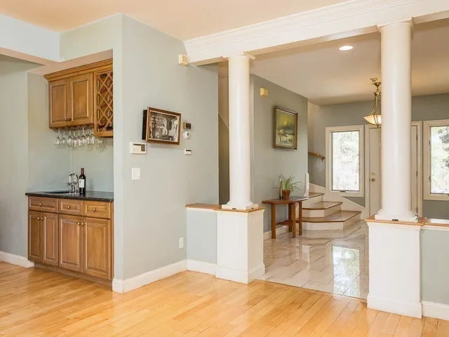 a view of a living room and kitchen