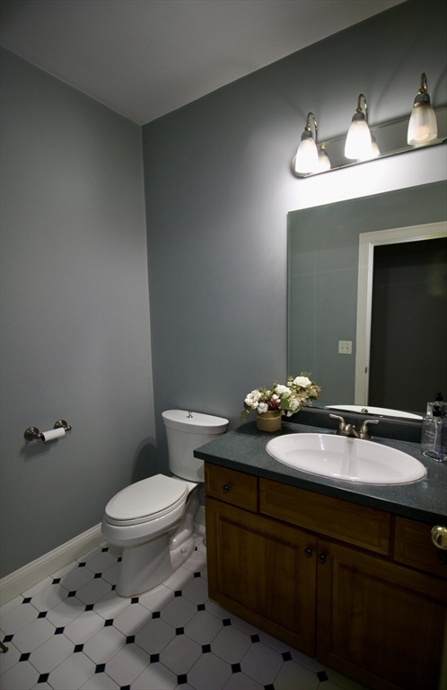 196 Country Club Way Ipswich, MA 01938 - Photo 20 of 33 a bathroom with a sink a toilet and a mirror