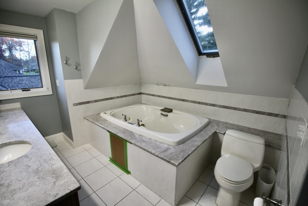 196 Country Club Way Ipswich, MA 01938 - Photo 26 of 33 a bathroom with a sink and mirror